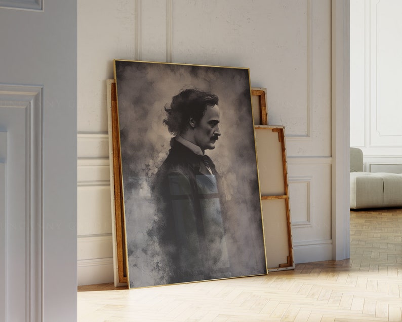 May include: A framed portrait of a man with dark hair and a mustache. The portrait is in a gold frame and is set against a white wall.