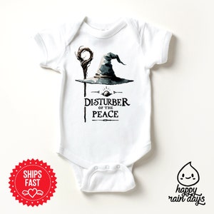 a baby bodysuit with a picture of a wizard hat on it