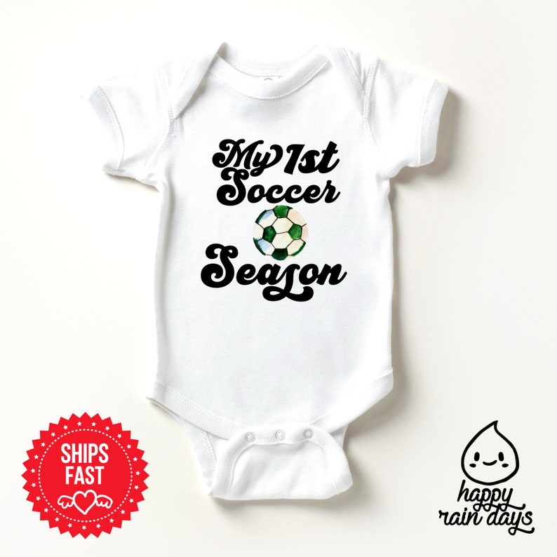 a baby bodysuit with a soccer ball on it