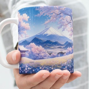 May include: White ceramic mug with a colorful image of Mount Fuji, cherry blossoms, and a small house. The image is in a blue, pink, and green color scheme.