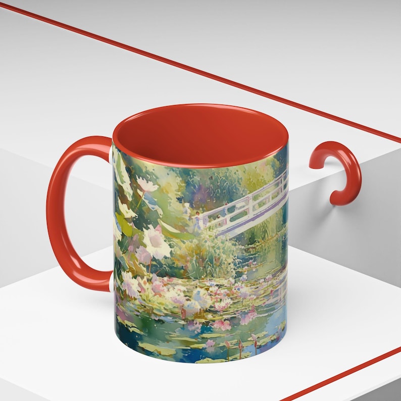Artistic mug featuring Monet’s water lilies and Japanese bridge, showcasing serene greens, soft pinks, and calm reflections inspired by his iconic garden scenes