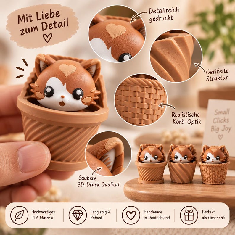May include: A brown and white cat figurine inside a textured basket. The cat has a heart-shaped mark on its forehead. The basket features a diagonal ribbed pattern and a woven texture. The image includes text: Mit Liebe zum Detail, Detailreich gedruckt, Gerifelte Struktur, Realistische Korb-Optik, Saubere 3D-Druck Qualit&auml;t, Small Clicks Big Joy, Hochwertiges PLA Material, Langlebig & Robust, Handmade in Deutschland, Perfekt als Geschenk.
