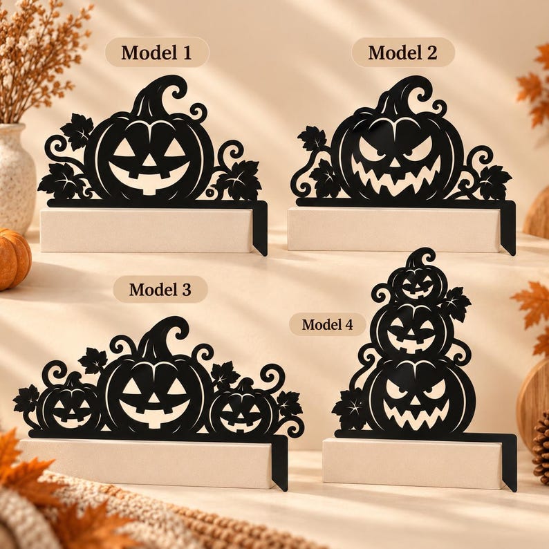 May include: Four black metal Halloween stocking holders labeled Model 1, Model 2, Model 3, and Model 4. Each features a flat base and a decorative silhouette of carved pumpkins with swirling vine and leaf accents in various arrangements.