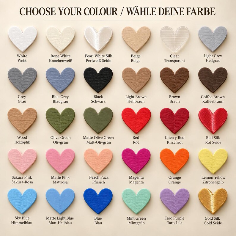 May include: A color chart featuring thirty heart-shaped swatches arranged in five rows of six. The text CHOOSE YOUR COLOUR / W&Auml;HLE DEINE FARBE appears at the top. Each heart is labeled with its corresponding color name in English and German.