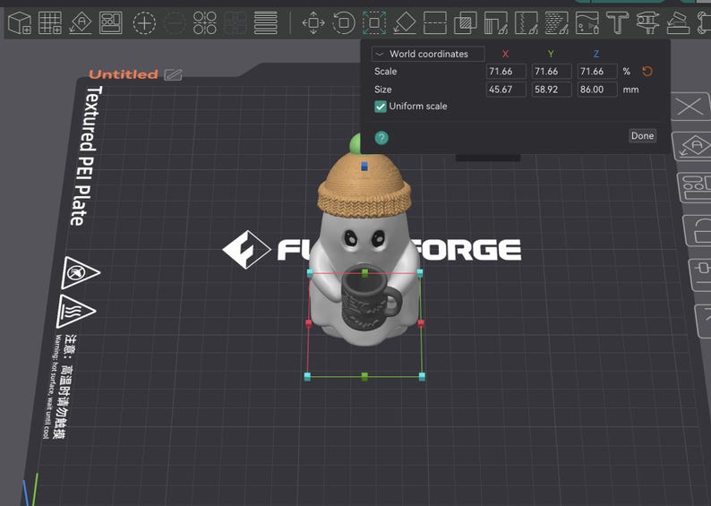 May include: A 3D digital model of a white ghost figure wearing a tan knit beanie with a green pom-pom, holding a dark gray mug. The software interface displays dimensions of 45.67 mm by 58.92 mm by 86.00 mm on a textured PEI plate background.