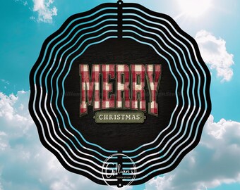 May include: A round, black and white Christmas decoration with the words "MERRY CHRISTMAS" in a red and white plaid pattern. The background is a blue sky with clouds.