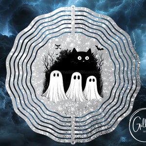 May include: A silver metal wind spinner featuring a black cat and three ghosts in a spooky woodland scene. The background is a sparkly silver with a blue cloudy sky.