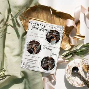May include: A wedding invitation with a white background and black text. The invitation features a floral design and two photos of the couple. The text reads "Nothing Fancy Just Love" and includes the couple's names, wedding date, and location. The invitation is on a gold leaf plate with a green plant and a pink ribbon.