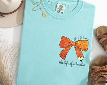 Comfort Colors® The Life Of A Teacher Bow Tee Custom Coquette Teacher Shirt Glitter Effect Bow Back To School Tee Teacher Appreciation Shirt