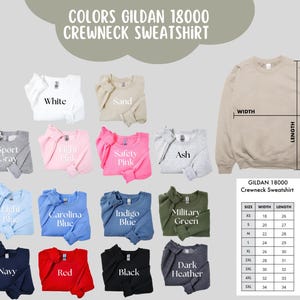 May include: A display of Gildan 18000 crewneck sweatshirts in various colors, including white, sand, sport gray, light pink, safety pink, ash, light blue, carolina blue, indigo blue, military green, navy, red, black, and dark heather. A size chart is also included.