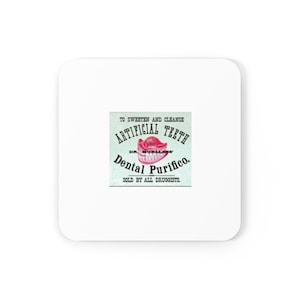 May include: Square white coaster with a vintage advertisement for "Artificial Teeth" and "Dental Purifico." The advertisement features a graphic of a set of dentures in pink and white, with text in black and green.