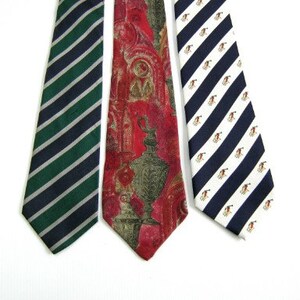 May include: Three neckties with different patterns. One is green and navy blue stripes, one is red with a gold and green floral pattern, and one is navy blue and white stripes with a small white design.