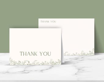 May include: Two white thank you cards with a simple floral design at the bottom. The text "Thank You" is printed in black on each card.