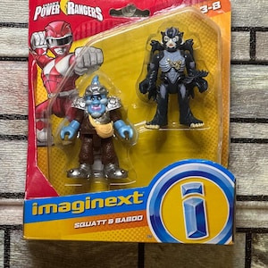 May include: Power Rangers Imaginext Squatt & Baboo action figures in a package. The package features a red and white Power Ranger illustration. The figures are blue, brown, and black. The package has the Imaginext logo.