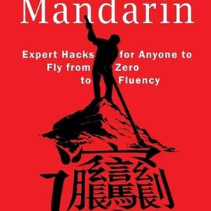 May include: A book cover with a red background and white text that reads "Mastering Mandarin." A black silhouette of a person stands atop a mountain. The book's title is above the text "Expert Hacks for Anyone to Fly from Zero to Fluency."
