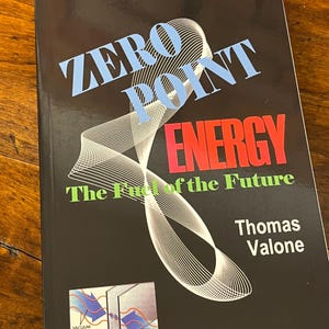 May include: A paperback book titled Zero Point Energy: The Fuel of the Future by Thomas Valone. The black cover features light blue text, a red title, green subtitle, and a white graphic of vacuum fluctuations and Casimir plates at the bottom.