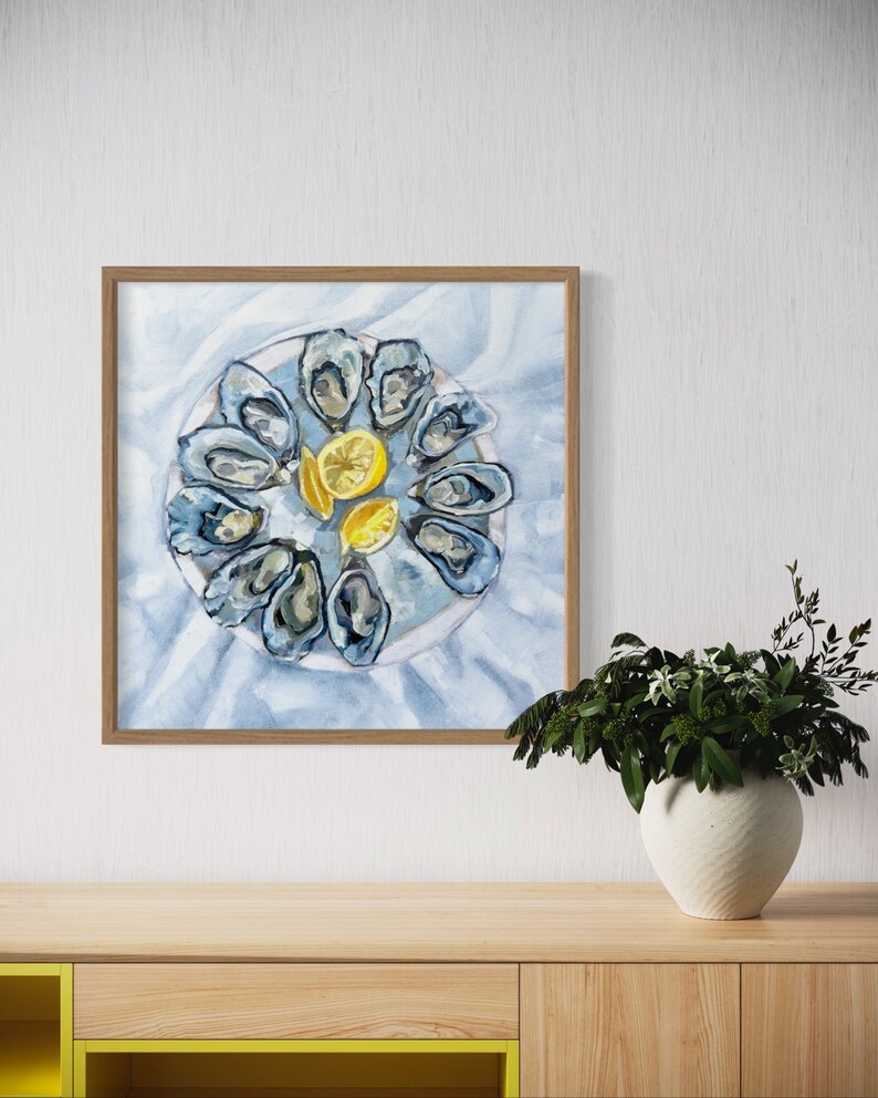 May include: A watercolor painting of a plate of oysters and lemon wedges. The oysters are arranged in a circle around the lemon wedges, which are in the center of the plate. The painting is done in shades of blue, white, and yellow.