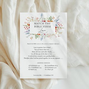 May include: A white rectangular game card titled Match the Bible Verse Love, decorated with a colorful floral border. The card features a list of six Bible verses with blank lines for matching, followed by answer choices A through F and a final verse.