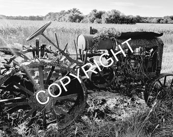 Tractor in field in black and white