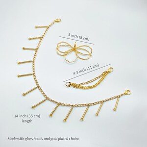 Handmade gold charm chain attached to shoes, creating a luxurious and unique touch.