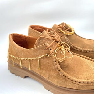 Boot chain with a blend of gold beads and chain, adding flair to ankle boots.