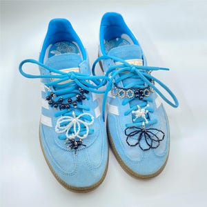 Add a Pop of Color to Your Shoes with Pearl and Black Charms.