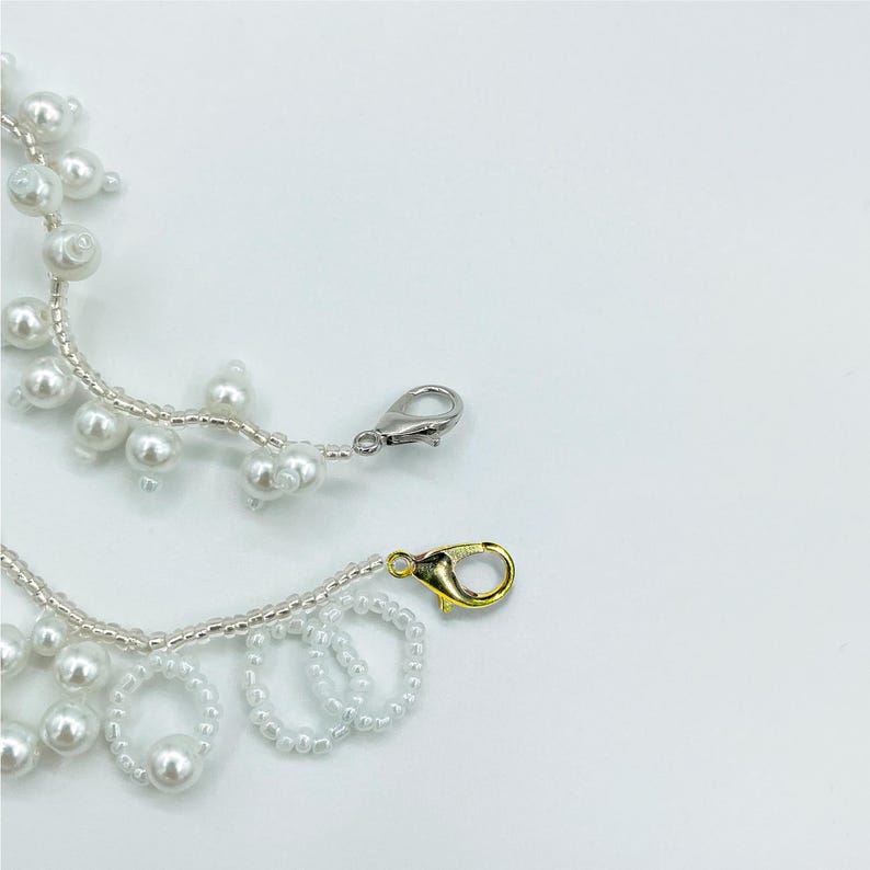 Gold and Silver Lobster Claw Charms with White Pearl Tassels.
