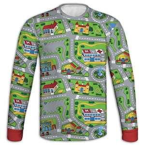 May include: Long-sleeved shirt with a playful city map design. The gray shirt features a network of roads, buildings, and green spaces. The cuffs are red, and the collar is white. The design includes hospitals, churches, and houses.