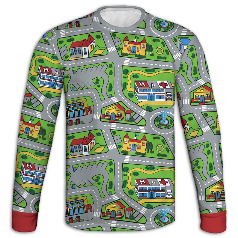 May include: Long-sleeved shirt with a playful city map design. The gray shirt features a network of roads, buildings, and green spaces. The cuffs are red, and the collar is white. The design includes hospitals, churches, and houses.