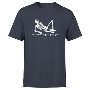 May include: A dark blue t-shirt with a white skeleton graphic and the text "draw me like one of your french girls".