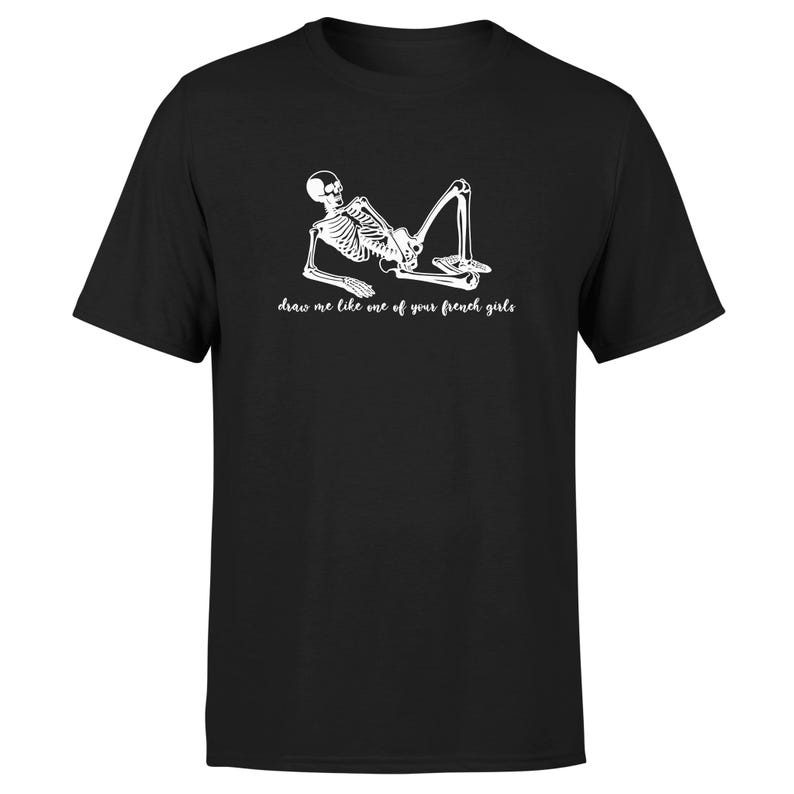 May include: Black t-shirt with a white skeleton graphic and the text "draw me like one of your french girls".