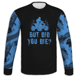 May include: Black long-sleeve shirt with a blue graphic of a person riding an ATV. The graphic includes the text "But Did You Die?" and a tire tread pattern on the sleeves.