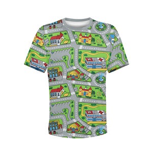 May include: A short-sleeved t-shirt featuring a colorful city map design. The shirt's pattern includes roads, buildings, parks, and a hospital, all set against a gray background. The design is playful and suitable for children.