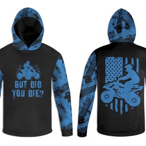 May include: Black long-sleeve hoodie with a blue and black tire tread pattern on the sleeves. The front of the hoodie has a graphic of a person riding an ATV with the text "But Did You Die?" The back of the hoodie has a graphic of an ATV with an American flag.