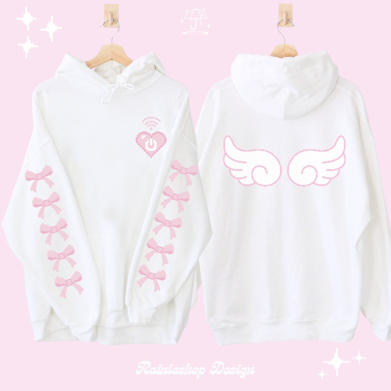 May include: White hoodie with pink pixelated heart with a wifi symbol and power button on the front. The sleeves have pink bows. The back of the hoodie has pink angel wings.