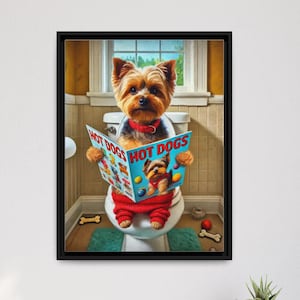 May include: A framed print featuring a Yorkshire Terrier sitting on a toilet, reading a magazine titled "HOT DOGS." The dog is wearing a red outfit and a bow tie. The bathroom setting includes a window, a green rug, and bone-shaped toys.