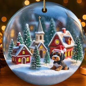 Snow globe style design personalized ceramic bernedoodle ornament with a warm backdrop Christmas dog ornament with festive winter scene.  Great gift idea for doodle moms and doodle dog lovers!