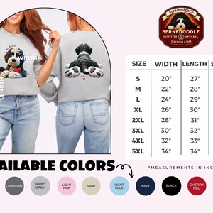 Unisex crewneck sweatshirt featuring an adorable claymation-style Bernedoodle dog illustration on the front, holding a red heart tag that can be personalized with a pet’s name. The back of the sweatshirt shows a cute rear-view Bernedoodle lying flat with detailed fluffy fur and oversized pink-paw pads, creating a playful “doodle mom” design. Ideal for Bernedoodle lovers, dog moms. Great for holidays, Mother’s Day, personalized pet gifts, and everyday cozy wear.