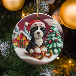 Custom Dog Ornament, Bernedoodle Sledding Keepsake | Sublimation Ceramic | 3 Inch Festive Decor, Santa Hat Doodle Gift image 1