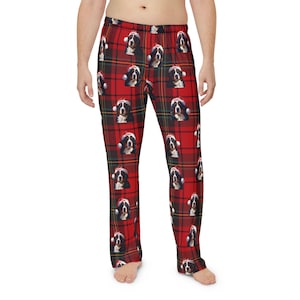 Men's pajama pants lounge wear personalized Christmas pajama bottoms with Bernese Mountain dogs wearing Santa Hat and their name is on the Santa Hat.  Bernese Mountain Dog dad gear!