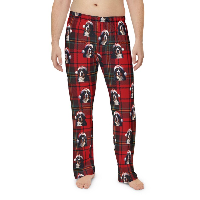Men's pajama pants lounge wear personalized Christmas pajama bottoms with Bernese Mountain dogs wearing Santa Hat and their name is on the Santa Hat.  Bernese Mountain Dog dad gear!