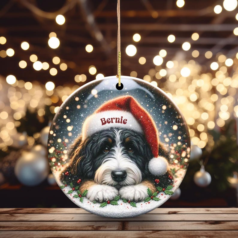 Bernedoodle dog wearing santa hat personalized ornament shown hanging by gold string