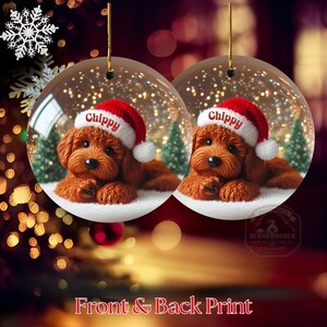 May include: Two clear Christmas baubles each feature a brown dog wearing a Santa hat with the name "Chippy". The baubles have a snowy base and small green trees. The text "Front & Back Print" is at the bottom.