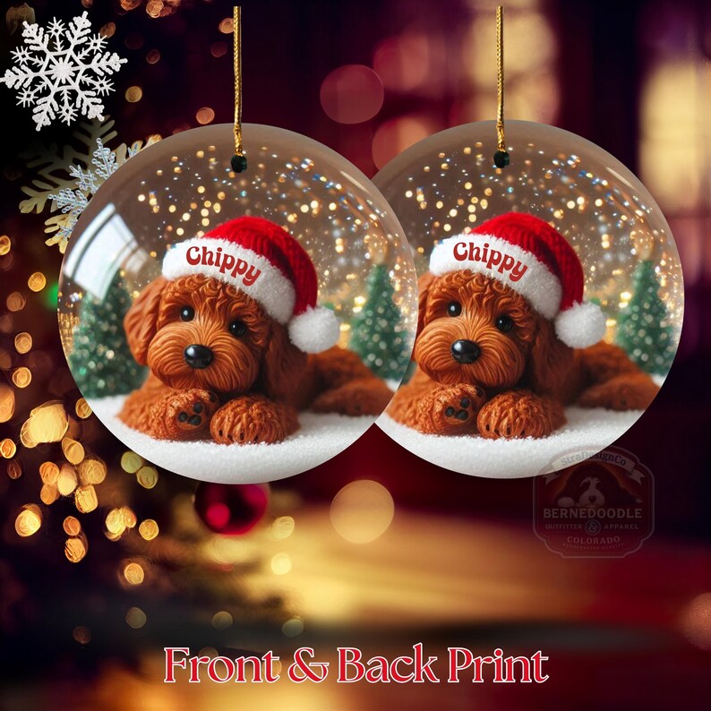 May include: Two clear Christmas baubles each feature a brown dog wearing a Santa hat with the name "Chippy". The baubles have a snowy base and small green trees. The text "Front & Back Print" is at the bottom.