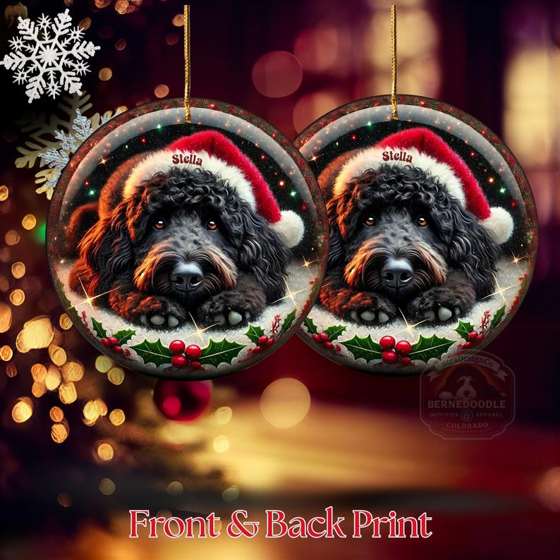 Black bernedoodle or labradoodle dog ceramic ornament show hanging with a gold string.  The ornament measures 3 inches in diameter and is a full gloss, printed on both sides.