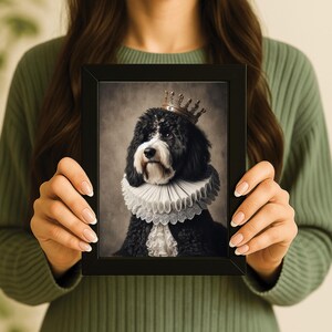May include: A framed portrait of a black and white dog wearing a gold crown and a ruffled collar. The dog has a regal appearance, with a serious expression. The background is a muted, vintage-style backdrop.