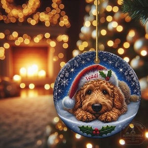 Golden Doodle dog ceramic ornament show hanging with a gold string.  The Goldendoodle Dog ornament measures 3 inches in diameter and is a full gloss, printed on both sides.