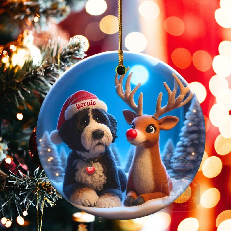 A fluffy Bernedoodle sits beside a gentle reindeer with a glowing red nose in a snowy winter forest. Soft blue and golden holiday lighting highlights the animals as snow falls around them. The Bernedoodle’s expressive face and the reindeer’s warm glow create a peaceful, magical Christmas scene perfect for woodland and dog-themed holiday décor.