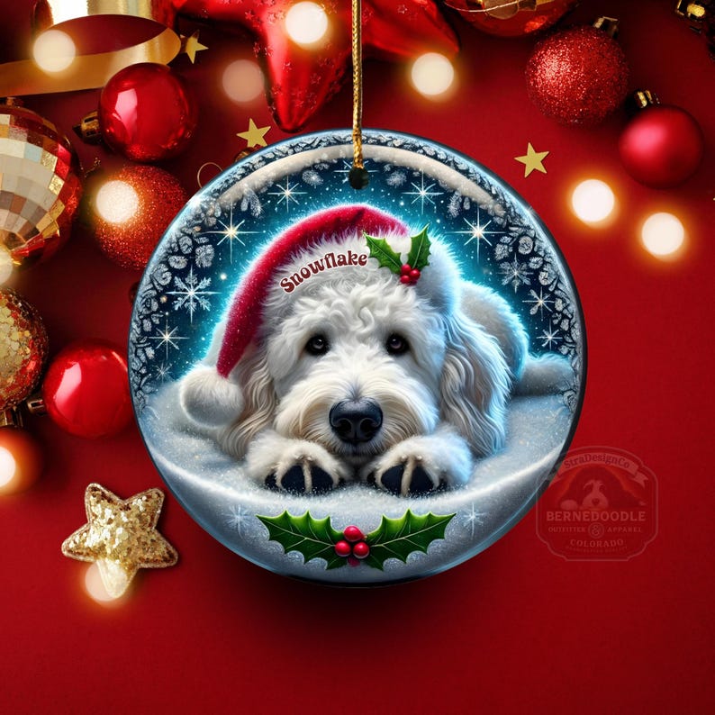 May include: A round Christmas ornament featuring a white dog wearing a Santa hat with the word "Snowflake". The ornament has a winter scene with snowflakes and holly. The background is red with Christmas decorations.