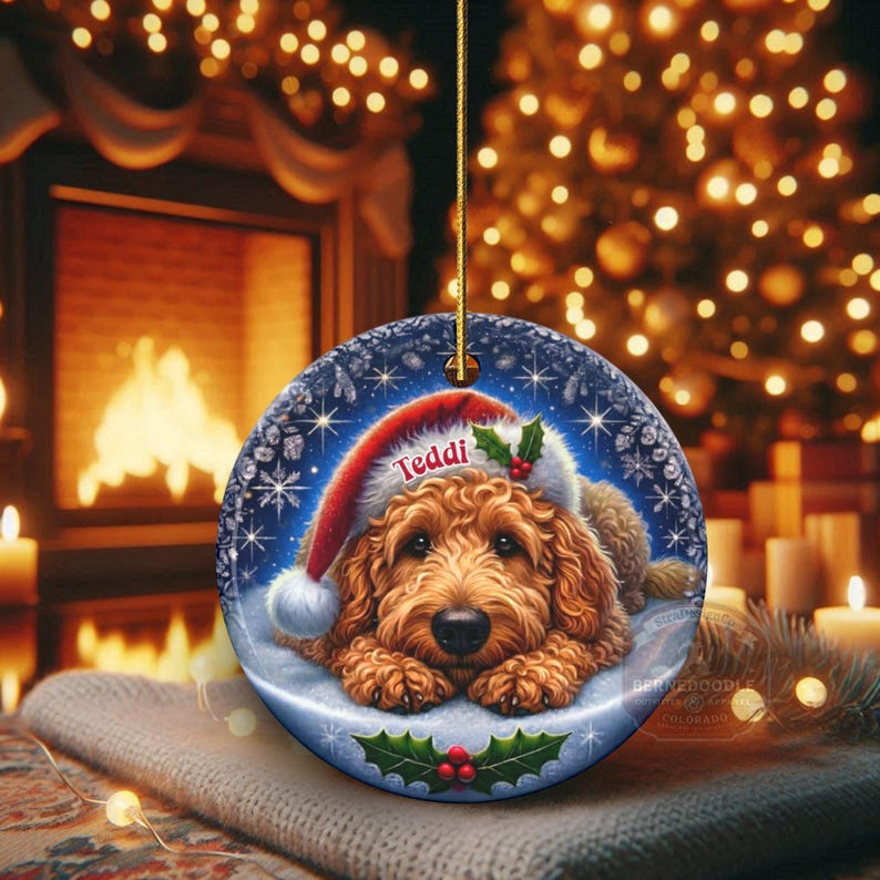 Golden Doodle dog ceramic ornament show hanging with a gold string.  The Goldendoodle Dog ornament measures 3 inches in diameter and is a full gloss, printed on both sides.